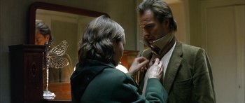 Movie still from “The Lives of Others” (2006), directed by Florian Henckel von Donnersmarck – A woman helping a man with a tie; Close Up shot, Over the shoulder angle