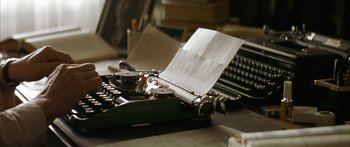 Movie still from “The Lives of Others” (2006), directed by Florian Henckel von Donnersmarck – An old fashioned typewriter with paper on top of it; Extreme Close Up shot, High angle