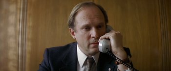 Movie still from “The Lives of Others” (2006), directed by Florian Henckel von Donnersmarck – A person talking on a phone; Close Up shot, Low angle