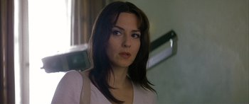 Movie still from “The Lives of Others” (2006), directed by Florian Henckel von Donnersmarck – A person with long brown hair; Close Up shot, Low angle