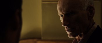 Movie still from “Real Steel” (2011), directed by Shawn Levy – The face of a bald man; Close Up shot, Low angle