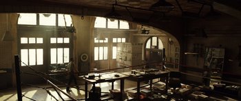 Movie still from “Real Steel” (2011), directed by Shawn Levy – A man walking through a room filled with boxes; Extreme Wide shot, High angle