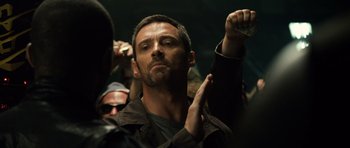 Movie still from “Real Steel” (2011), directed by Shawn Levy – A person holding something in his hand; Close Up shot, Over the shoulder angle