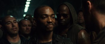 Movie still from “Real Steel” (2011), directed by Shawn Levy – A man in a leather jacket and a man in a black jacket; Close Up shot, Over the shoulder angle