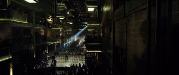 Movie still from “Real Steel” (2011), directed by Shawn Levy – A crowd of people standing in a room; Extreme Wide shot, High angle