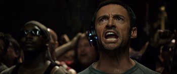 Movie still from “Real Steel” (2011), directed by Shawn Levy – A person with headphones on; Close Up shot, Low angle