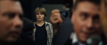 Movie still from “Real Steel” (2011), directed by Shawn Levy – A young man taking a picture of himself in the mirror; Close Up shot, Over the shoulder angle