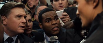 Movie still from “Real Steel” (2011), directed by Shawn Levy – A group of people in a room with microphones; Close Up shot, Over the shoulder angle