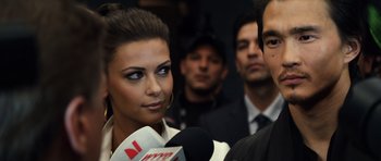 Movie still from “Real Steel” (2011), directed by Shawn Levy – A woman is being interviewed by a reporter; Close Up shot, Over the shoulder angle