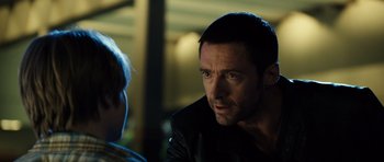 Movie still from “Real Steel” (2011), directed by Shawn Levy – A person wearing a leather jacket; Close Up shot, Over the shoulder angle