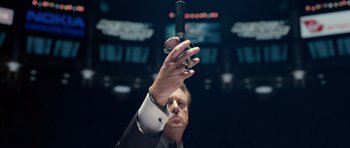 Movie still from “Real Steel” (2011), directed by Shawn Levy – A man in a black suit holding a car key; Extreme Close Up shot, Low angle