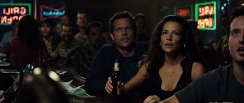 Movie still from “Real Steel” (2011), directed by Shawn Levy – A man and a woman sitting at a table with a bottle of beer; Close Up shot, Over the shoulder angle