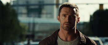 Movie still from “Real Steel” (2011), directed by Shawn Levy – A person wearing a jacket; Close Up shot, Over the shoulder angle