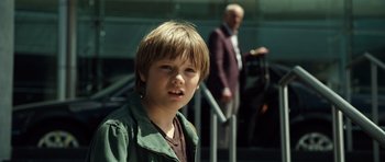 Movie still from “Real Steel” (2011), directed by Shawn Levy – A young boy standing in front of an older man; Close Up shot, Over the shoulder angle