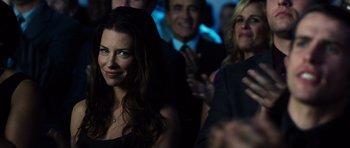 Movie still from “Real Steel” (2011), directed by Shawn Levy – A group of people standing in a room; Close Up shot, Over the shoulder angle