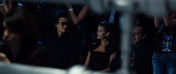 Movie still from “Real Steel” (2011), directed by Shawn Levy – A man and a woman are sitting in a dark room; Medium shot, Over the shoulder angle