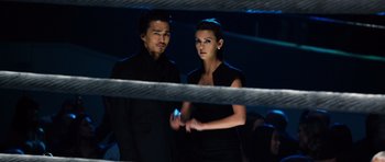 Movie still from “Real Steel” (2011), directed by Shawn Levy – A man and a woman standing next to each other in a boxing ring; Medium shot, Low angle