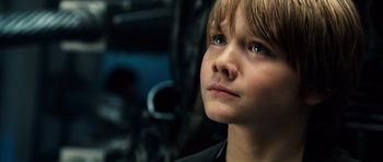 Movie still from “Real Steel” (2011), directed by Shawn Levy – A young boy looking up; Close Up shot, Low angle