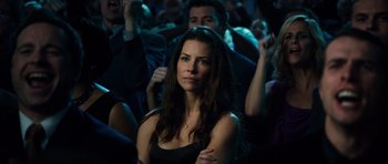 Movie still from “Real Steel” (2011), directed by Shawn Levy – A beautiful woman sitting in front of an audience; Close Up shot, Over the shoulder angle