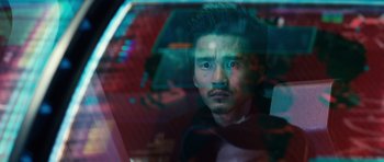 Movie still from “Real Steel” (2011), directed by Shawn Levy – A man with a beard is looking out of a window; Close Up shot, Over the shoulder angle