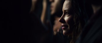 Movie still from “Real Steel” (2011), directed by Shawn Levy – A woman's face in the dark; Close Up shot, Over the shoulder angle