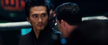 Movie still from “Real Steel” (2011), directed by Shawn Levy – Two men are talking to each other in a dark room; Close Up shot, Over the shoulder angle