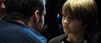 Movie still from “Real Steel” (2011), directed by Shawn Levy – A man and a boy looking at one another; Close Up shot, Over the shoulder angle