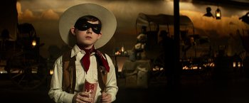 Movie still from “The Lone Ranger” (2013), directed by Gore Verbinski – A young boy dressed up as a cowboy; Medium shot, Low angle