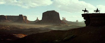 Movie still from “The Lone Ranger” (2013), directed by Gore Verbinski – A view of a desert landscape with a mountain in the background; Extreme Wide shot, Low angle