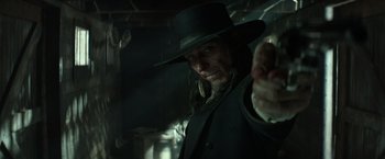 Movie still from “The Lone Ranger” (2013), directed by Gore Verbinski – A man in a black hat and a long coat; Close Up shot, Low angle