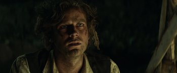 Movie still from “The Lone Ranger” (2013), directed by Gore Verbinski – A person wearing a shirt and hat; Close Up shot, Low angle