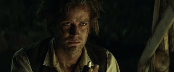 Movie still from “The Lone Ranger” (2013), directed by Gore Verbinski – A person holding a cell phone; Close Up shot, Over the shoulder angle