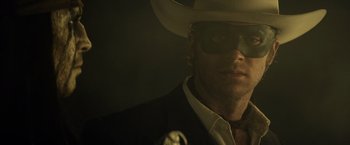 Movie still from “The Lone Ranger” (2013), directed by Gore Verbinski – A man wearing a cowboy hat and sunglasses; Close Up shot, Low angle