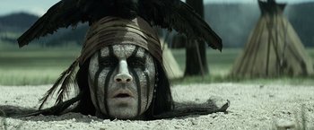 Movie still from “The Lone Ranger” (2013), directed by Gore Verbinski – A person with a bird on his head; Close Up shot, High angle