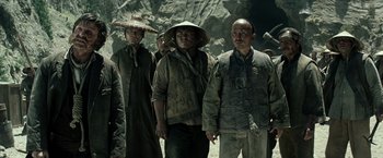 Movie still from “The Lone Ranger” (2013), directed by Gore Verbinski – A group of men standing next to each other; Medium shot, High angle