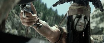 Movie still from “The Lone Ranger” (2013), directed by Gore Verbinski – A person holding a gun; Close Up shot, Low angle