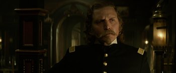 Movie still from “The Lone Ranger” (2013), directed by Gore Verbinski – A person wearing a uniform; Close Up shot, Over the shoulder angle