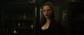 Movie still from “The Lone Ranger” (2013), directed by Gore Verbinski – A woman in a black dress with red lipstick; Close Up shot, Low angle