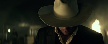 Movie still from “The Lone Ranger” (2013), directed by Gore Verbinski – A person wearing a cowboy hat; Close Up shot, Low angle