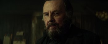 Movie still from “The Lone Ranger” (2013), directed by Gore Verbinski – An old man with a beard and a mustache; Close Up shot, Low angle