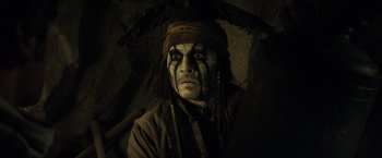 Movie still from “The Lone Ranger” (2013), directed by Gore Verbinski – A person with a face paint; Close Up shot, High angle