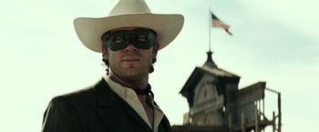 Movie still from “The Lone Ranger” (2013), directed by Gore Verbinski – A man wearing a white hat and a mask; Close Up shot, Low angle