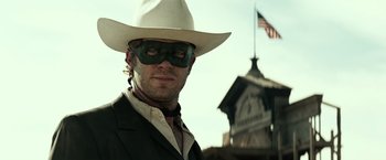 Movie still from “The Lone Ranger” (2013), directed by Gore Verbinski – A man wearing a white hat and a green mask; Close Up shot, Low angle