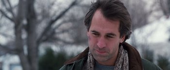 Movie still from “The Long Kiss Goodnight” (1996), directed by Renny Harlin – A person wearing a jacket; Close Up shot, Over the shoulder angle