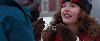 Movie still from “The Long Kiss Goodnight” (1996), directed by Renny Harlin – A woman wearing brown gloves holding a key; Close Up shot, Over the shoulder angle