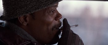 Movie still from “The Long Kiss Goodnight” (1996), directed by Renny Harlin – A person with a cigarette in his mouth; Extreme Close Up shot, Low angle