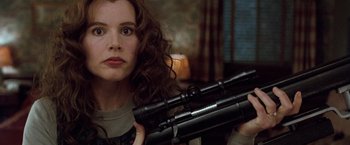 Movie still from “The Long Kiss Goodnight” (1996), directed by Renny Harlin – A woman holding a pair of binoculars in her hands; Close Up shot, Over the shoulder angle