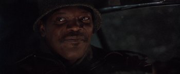 Movie still from “The Long Kiss Goodnight” (1996), directed by Renny Harlin – A person wearing a hat; Close Up shot, Low angle