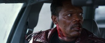 Movie still from “The Long Kiss Goodnight” (1996), directed by Renny Harlin – A person with blood on his face; Close Up shot, Over the shoulder angle