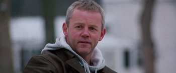 Movie still from “The Long Kiss Goodnight” (1996), directed by Renny Harlin – A person wearing a jacket; Close Up shot, Low angle